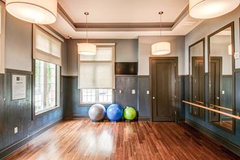 Yoga studio with mirrors and exercise balls